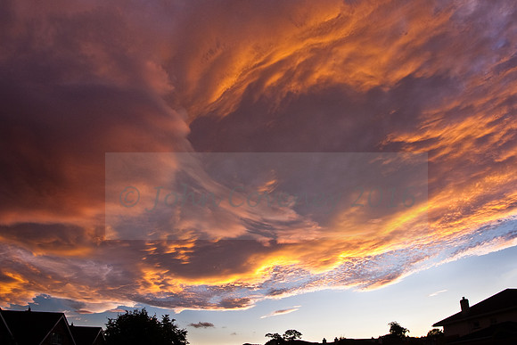 Spectacular sunlit clouds at sunset over Castle Farm in Shankill.